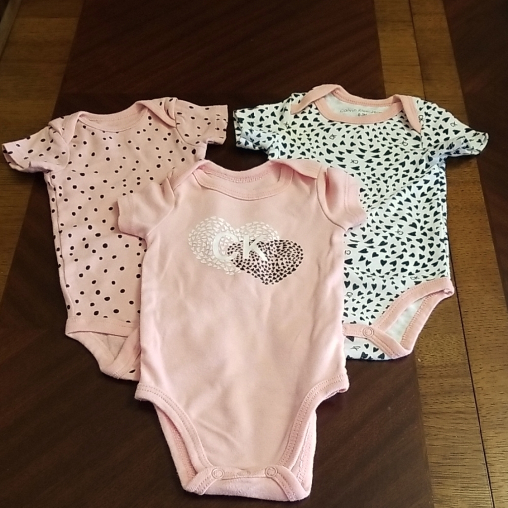 ❣5 for $25 Sale❣ Bundle Of Calvin Klein Peach, Black & White Baby Onesies